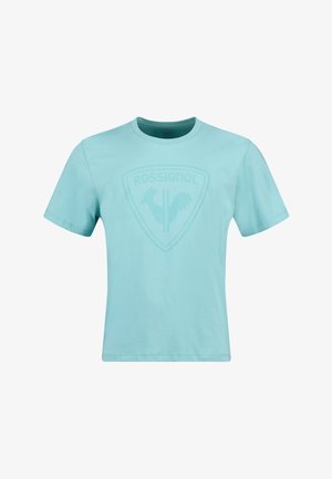 Lichtblauw T-shirt met korte mouwen van katoen, met een tonale schildlogo met een haan en de tekst "ROSSIGNOL" op de borst.