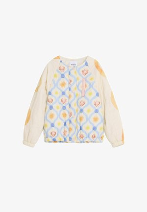 Veste matelassée à manches longues avec poignets élastiques, motif floral bleu et jaune sur le devant et motifs circulaires pêche sur les manches crème.