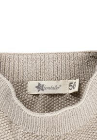 Beige knitted sweater collar with a fabric label showing a star logo, brand name "Sterntaler," and size number 56.