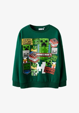 Zielona bawełniana bluza z pikselowymi grafikami z Minecrafta, w tym ikonami takimi jak Creepery i TNT, z tekstowymi elementami związanymi z tematyką gier.