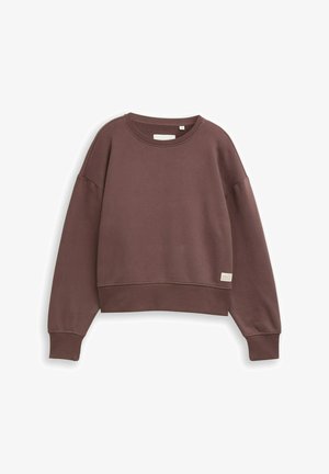 Hnědá zkrácená mikina vyrobená z měkké tkaniny, s kulatým výstřihem a žebrovanými manžetami, s malou cedulkou na dolním levém okraji.