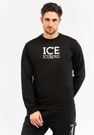 Black sweatshirt with “ICE ICEBERG” printed in white font on the front. Features a crew neck and long sleeves, made from soft fabric.