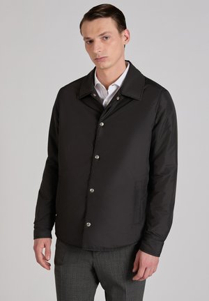 - Kurtka przejściowa