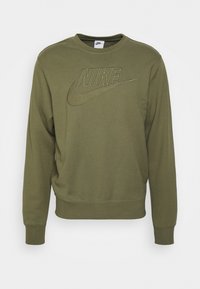 Sweatshirt Nike vert olive avec poignets et ourlet côtelés. Présente un logo brodé sur le devant. Fabriqué en tissu doux et texturé.