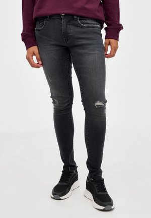 CON ROTO - Vaqueros slim fit -  black vaquero