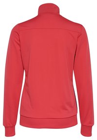 Veste zippée rouge avec un col montant, des manches longues, une couleur unie, et des poignets et ourlet côtelés. Dotée d'un tissu lisse et léger.