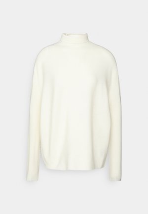 Zachte, ivoren turtleneck trui met een ontspannen, oversized uitstraling. Kenmerkt zich door lange mouwen en een gladde, gezellige textuur.