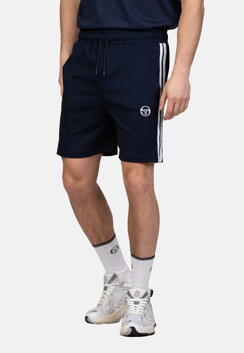 Navy athletic shorts made of lightweight fabric, featuring white side stripes, elastic waistband with drawstring, and a logo on the hip.
