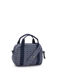 Navy bag made of patterned fabric with a geometric design, double top handles, and a zip closure. Features a side accent and button detail.