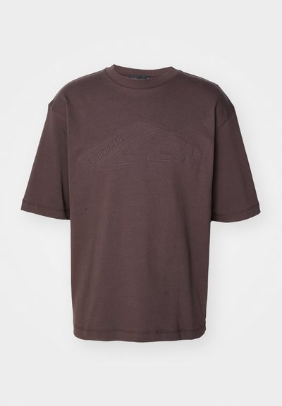Camiseta de algodón marrón oscuro con cuello redondo y mangas cortas. Logo en relieve "DSQUARED2 ICON" en el frente. Corte holgado.