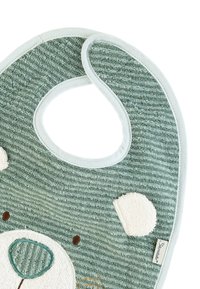 Cotton bib in pale green with textured stripes. Features a bear design with white accents and embroidered details. Circular neck opening.