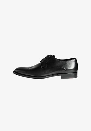 Black polished leather men's dress shoe with lace-up closure and low heel, shown in side profile on white background.