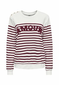 Chemise blanche à manches longues avec des rayures horizontales bordeaux, texte "AMOUR" sur la poitrine et trois boutons dorés sur l'épaule gauche.
