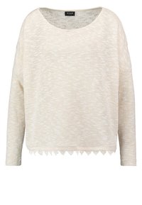 Pull en maille beige à manches longues avec encolure ronde et délicate bordure en dentelle le long de l'ourlet, design minimaliste de VILA.