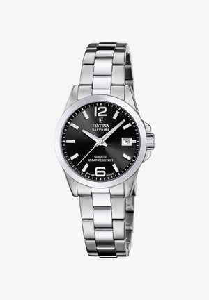 Reloj de acero inoxidable plateado con un dial negro redondo, marcadores de hora blancos, indicador de fecha a las 3 en punto y una pulsera de eslabones. Cristal de zafiro.