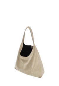 Bézs színű, velúr női kézitáska strukturált formával, egy vállpánttal és széles nyílással, fekete belsőt mutatva.