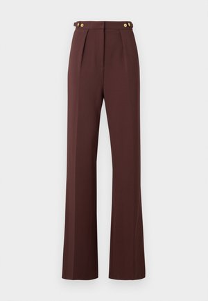 High-waist brown wide-leg trousers with front pleats and gold button details on adjustable waist tabs.