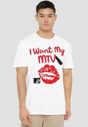 White cotton t-shirt featuring red text "I Want My MTV" and a red lip print, with a black lipstick graphic and MTV logo in the corner.
