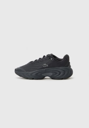 Black athletic shoes with textured fabric upper, curved rubber sole, and subtle logo detail on the side. Lightweight and modern design.