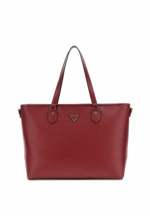 Sac fourre-tout synthétique rouge avec surface texturée, deux longues poignées et un logo triangulaire. Présente des accents hexagonaux près du matériel.