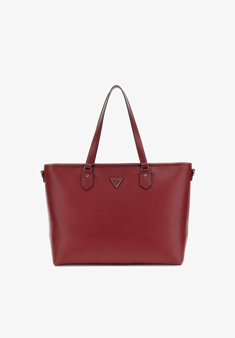 Sac fourre-tout synthétique rouge avec surface texturée, deux longues poignées et un logo triangulaire. Présente des accents hexagonaux près du matériel.