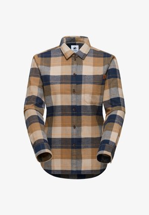 Camicia in flanella a quadri marrone e blu navy con maniche lunghe, polsini abbottonati e taschino sul petto. Caratterizzata da un orlo arrotondato e bottoni in legno.