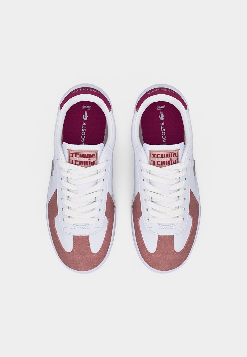 Pair of white and dusty pink Lacoste tennis shoes with white laces and burgundy insoles, viewed from above on a white background.