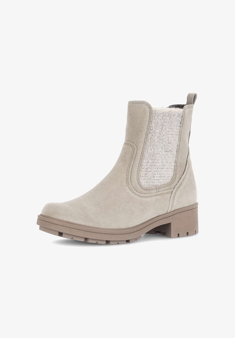 Beige ankle boot with a suede finish, elastic side panel in textured fabric, round toe, and a low block heel. Features traction outsole.