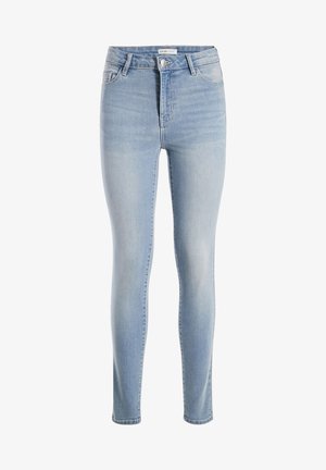 Jean skinny en denim bleu clair avec taille haute, design à cinq poches et décoloration subtile. Dispose d'une fermeture à bouton à l'avant et de passants de ceinture.