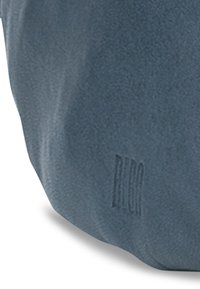 Textured blue suede material features a wavy design with visible stitching. Notable embossed branding on the side.