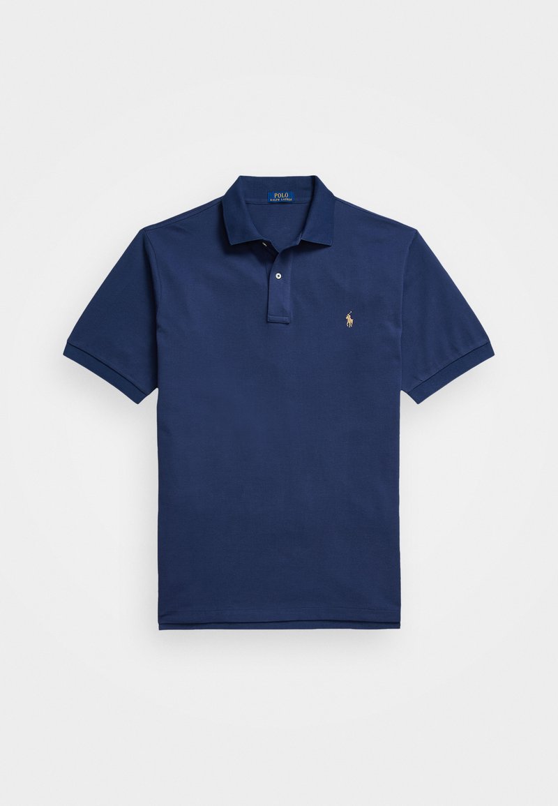 Polo en bleu marine en coton, avec une patte de boutonnage à deux boutons, des manches courtes, et un petit logo brodé sur la poitrine gauche.