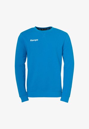 Turkoois sweatshirt met lange mouwen, geribbelde manchetten en ronde hals. Voorzien van wit "Kempa" logo op de voorkant. Soepele textuur.