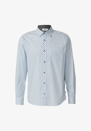 Gaiši zils garām piedurknēm pogājams krekls ar mazu tumši zilu dimantu rakstu un kabatu kreisajā krūtī.