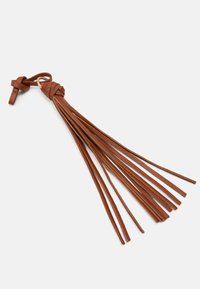 Brown leather tassel keychain features multiple elongated strips, tied at the top with a knot and a gold-colored ring for attachment.