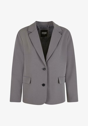 Sivina blazer iz gladkega materiala ima ovratnik v obliki klina, dva gumba in stranska žepa s prilegajočim krojem ter minimalnimi šivi.