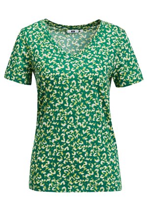 Zielona koszulka z krótkim rękawem i dekoltem w serek z białym i żółtym abstrakcyjnym wzorem kwiatowym, przedstawiona na jednolitym białym tle.