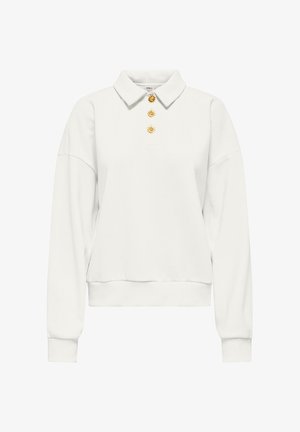 Polo blanc à manches longues avec col, orné de trois boutons décoratifs dorés en forme de soleil sur le devant.