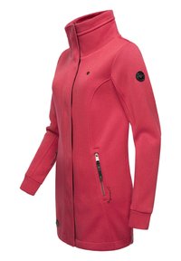 Fleece jacket in vivid pink, features a high collar, zippered side pockets, and elastic cuffs, with a logo patch on the left shoulder.