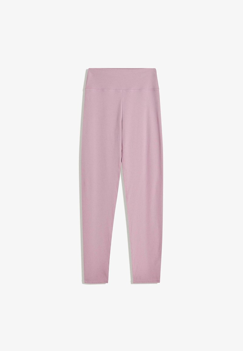 Legging extensible et moulant en tissu rose clair. Présente une taille large, un design sans coutures et une texture lisse sans motifs.
