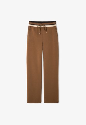Pantaloni della tuta marroni con vita regolabile e strisce orizzontali marroni e crema. Realizzati in un materiale morbido e testurizzato.