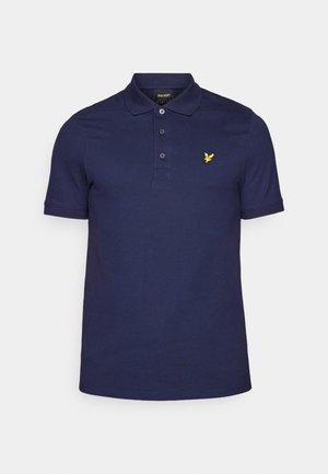 Navy blue polo shirt made of cotton, featuring a three-button placket and a small yellow logo on the left chest. Short sleeves and subtle texture.