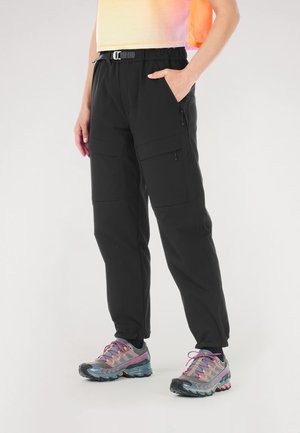 Black cargo pants with an elastic waistband and adjustable belt, featuring multiple zippered pockets and a tapered leg design.