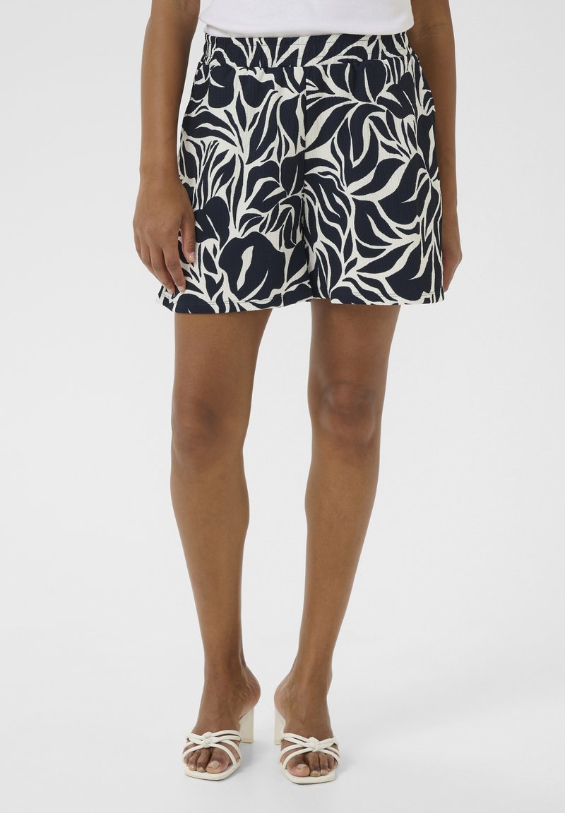 Pantaloni corti navy con motivo floreale, dotati di una vita elasticizzata. Realizzati in tessuto leggero, presentano una vestibilità morbida e tasche laterali.