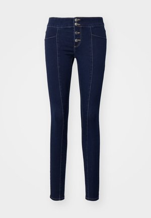 Ciemnoniebieskie skinny jeans wykonane z denimu, z wysokim stanem, pięcioma guzikami z przodu, kontrastowym przeszyciem i przednimi kieszeniami.