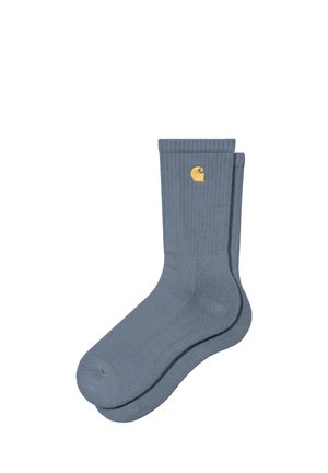 Paar blaue gerippte Sneakersocken mit kleinem gelben Logo auf der Oberseite, vor weißem Hintergrund gezeigt.