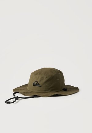 Olive green wide-brim hat with black adjustable chin strap and embroidered logo on front, displayed on plain white background.