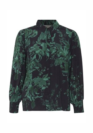 Blouse noire à manches longues boutonnée avec un motif floral feuillu vert, poignets froncés et col classique.