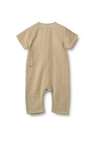 Beige bomullsromper med korta ärmar, texturerad tyg och en bakficka med en liten logotyp. Rundad halsringning och avslappnad passform.