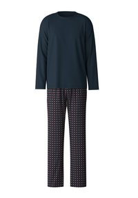 Marineblauwe lange mouw top gecombineerd met gestreepte pyjamabroek met een geometrisch patroon in rood en wit op een donkere achtergrond. Zachte stof.