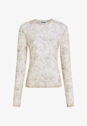 Haut ajusté à manches longues beige avec un motif floral subtil et le logo "KARL LAGERFELD JEANS" centré sur la poitrine.